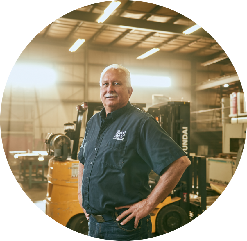 man standing in manufacturing warehouse