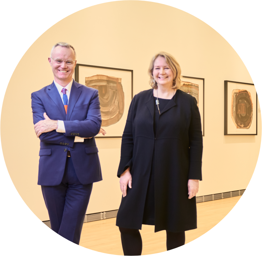 man and woman standing in art museum gallery