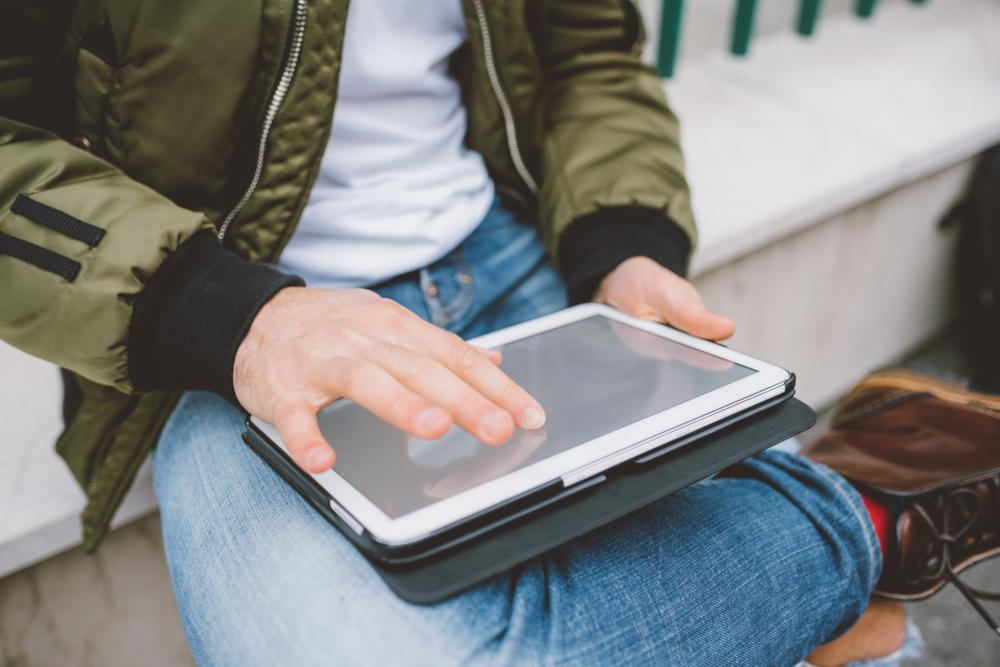 Man shopping online on his tablet