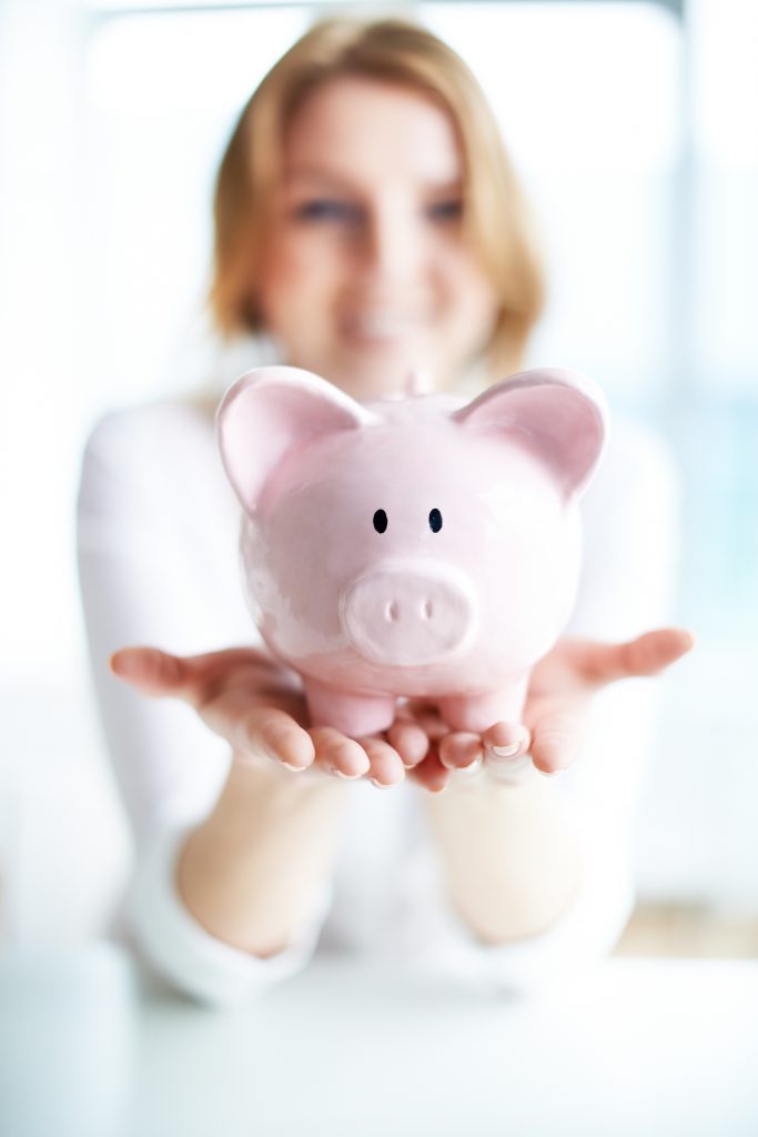 Girl holding piggy bank