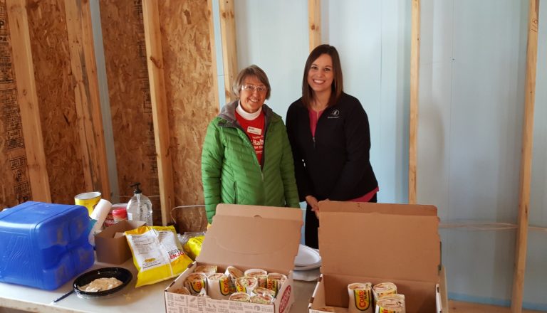 Horicon Bank employee and food pantry representative