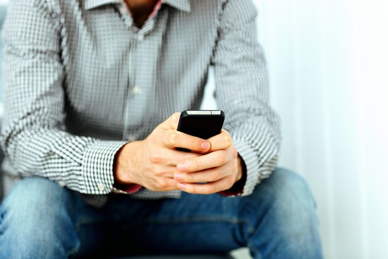 man holding cell phone