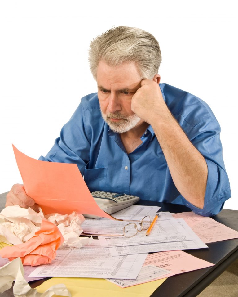 Man looking at taxes