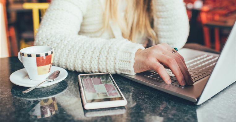 woman on laptop in coffee shop