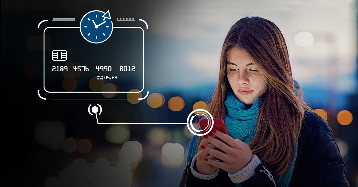 Girl holding phone with credit card image